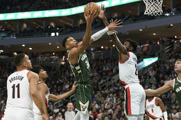 Milwaukee Bucks forward Giannis Antetokounmpo (34) shoots against Portland Trail Blazers center Deandre Ayton (2)